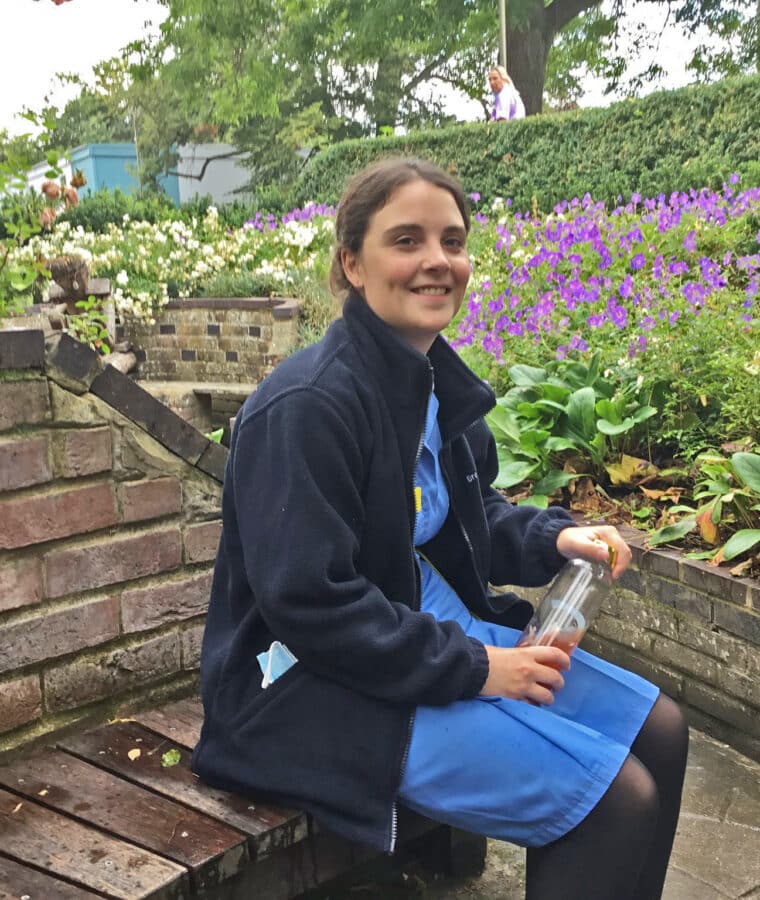 Staff member Clare sitting in Sunken Dell Garden at Broomfield Hospital