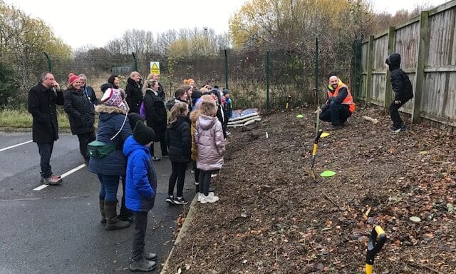 School children plant trees at Oaks Park
