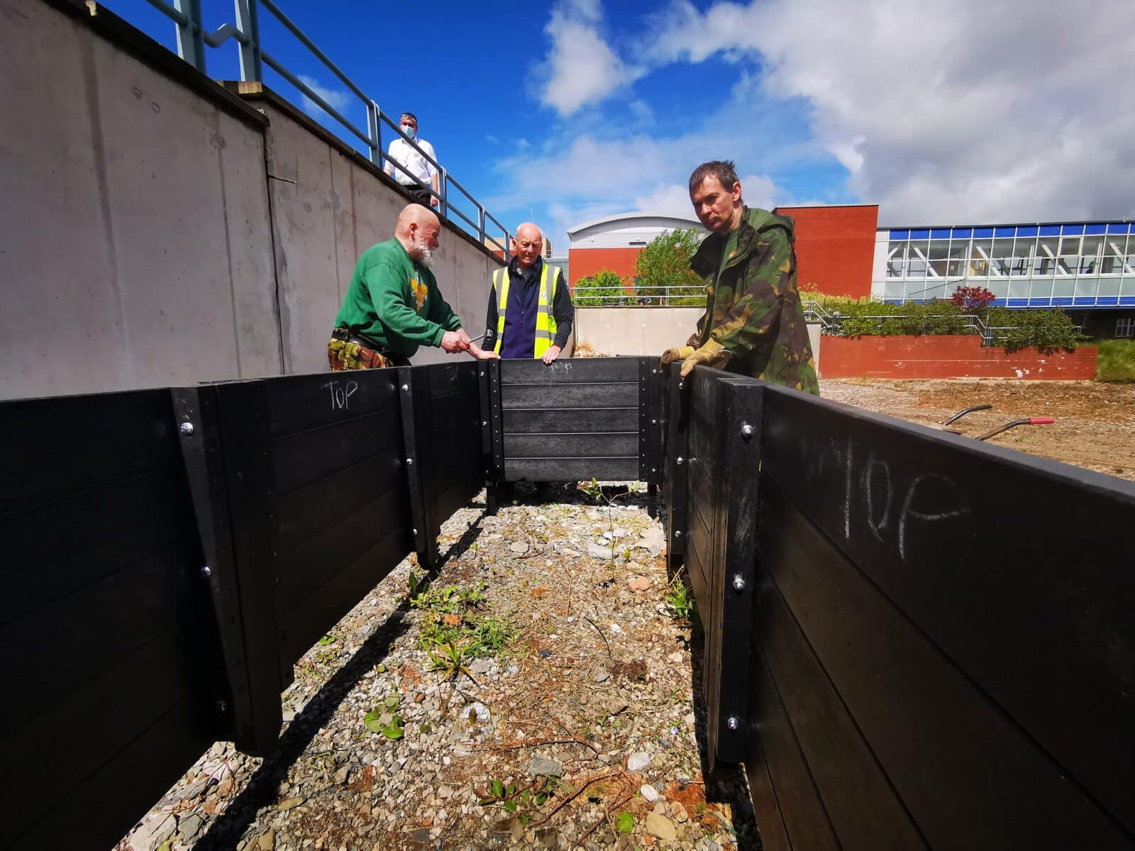 The Conservation Volunteers constructing veg beds from recycled plastic for Incredible Edible, at Liverpool Hospitals