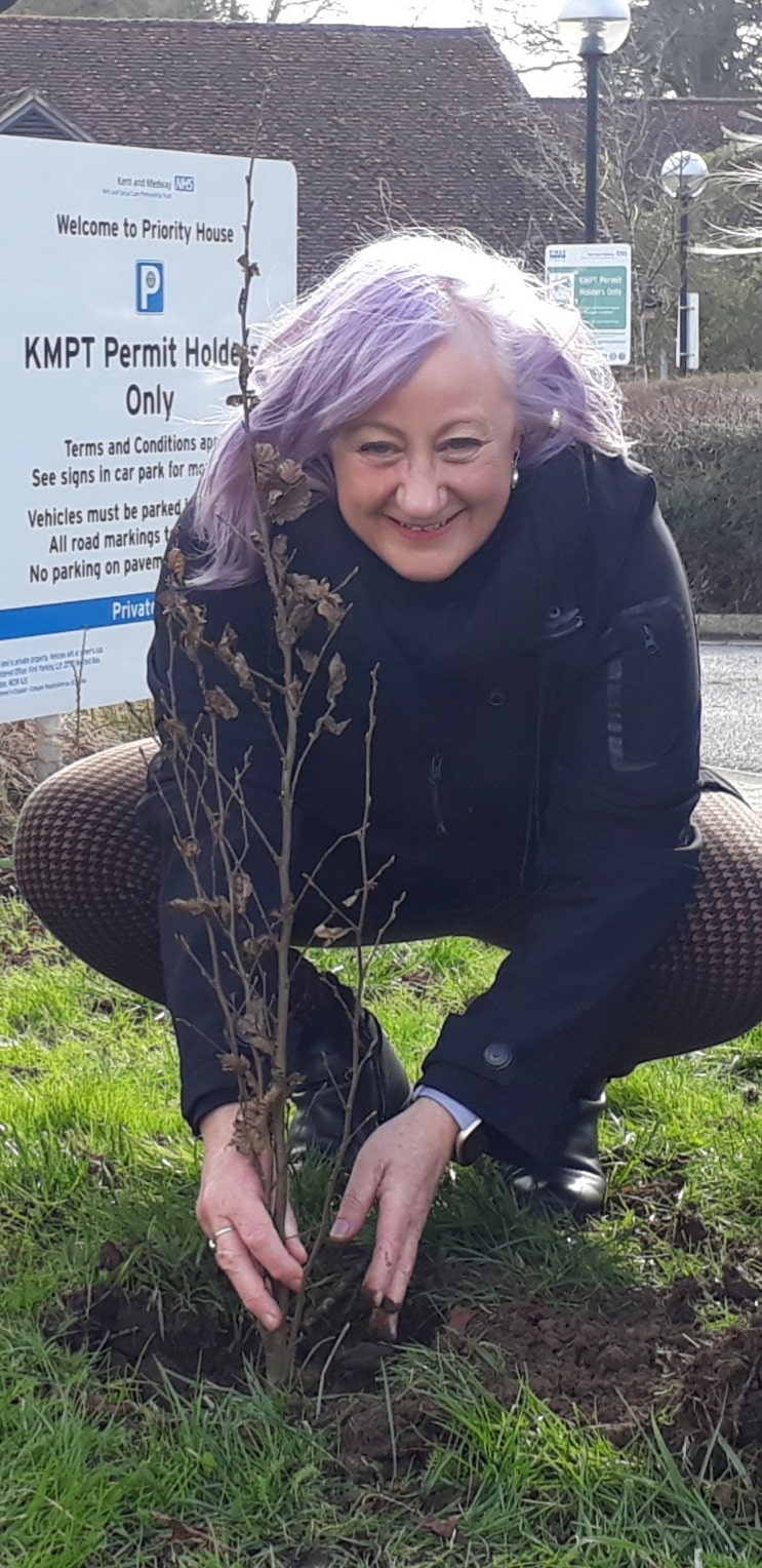 Catronia Toms plants a tree at Priority House
