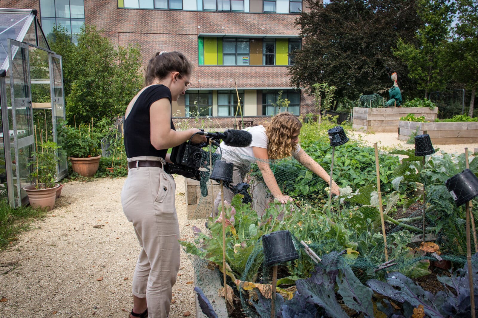 Filmmaker Zoe East of Opal Video, filming ranger Phoebe Webster at Southmead Hospital