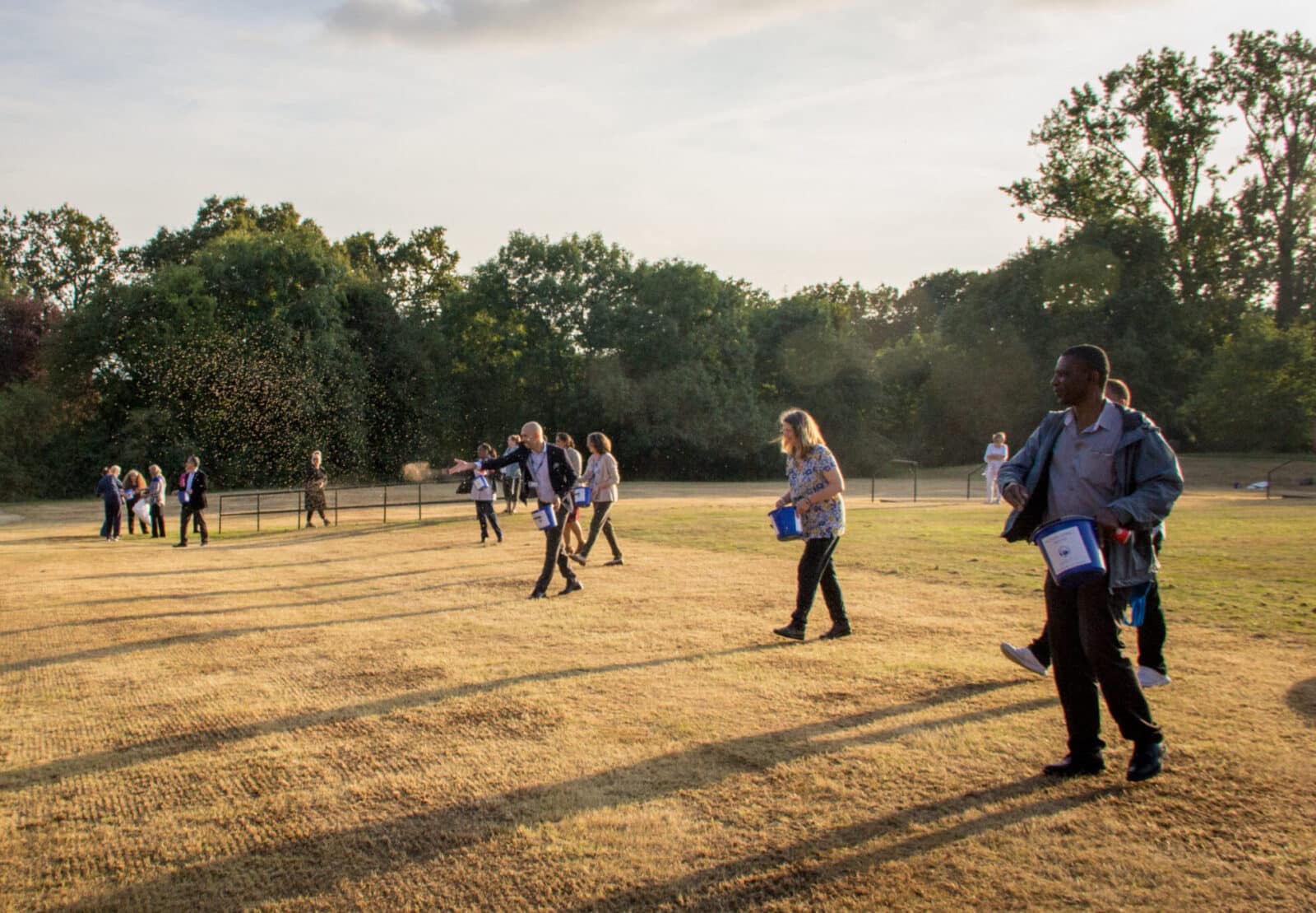 Staff and other volunteers scatter native wildflower seeds at Mount Vernon Cancer Centre. Credit: Vicki Brown / CSH September 2021 Attribution 4.0 International (CC BY 4.0).
