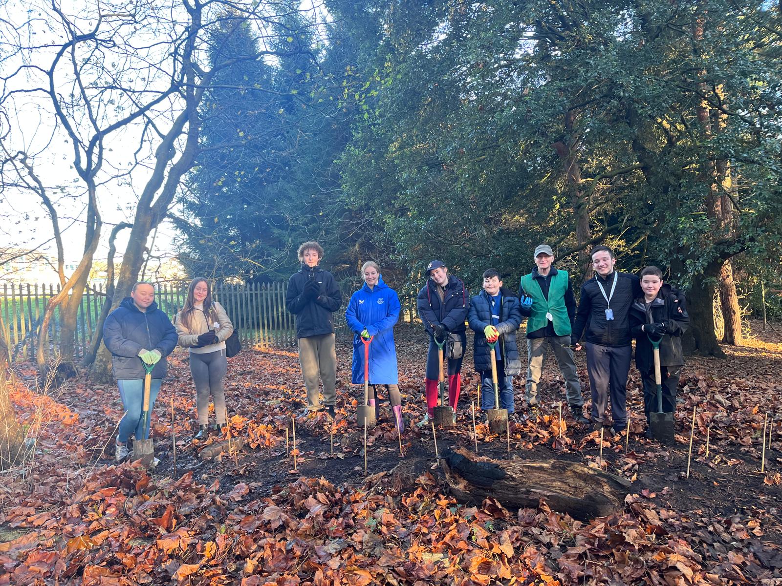 Tree planting volunteers with ranger Nick White in Bluebell Woods at Aintree Hospital in November 2024. Attribution 4.0 International (CC BY 4.0).